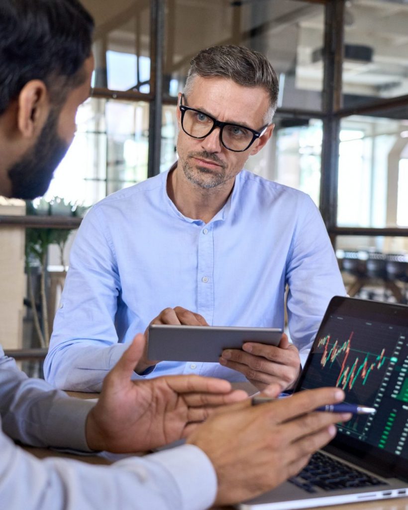 Two traders brokers stock exchange market investors discussing crypto trading.